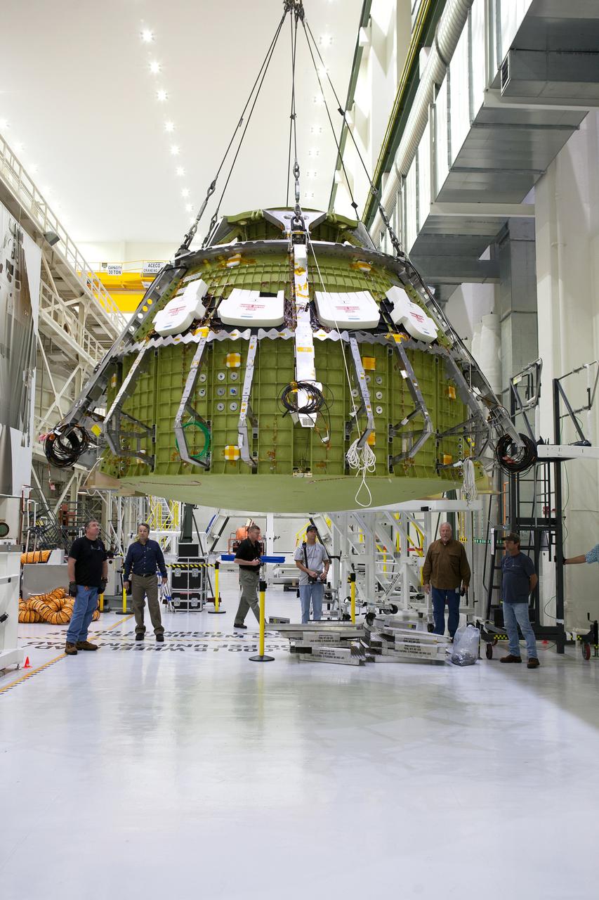 The Orion crew module for Artemis I is lifted into a test stand for pressure testing in the Neil Armstrong Operations and Checkout Building at NASA's Kennedy Space Center in Florida on April 21, 2016.