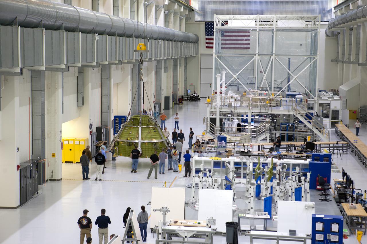 The Orion crew module for Artemis I is lifted into a test stand for pressure testing in the Neil Armstrong Operations and Checkout Building at NASA's Kennedy Space Center in Florida on April 21, 2016.