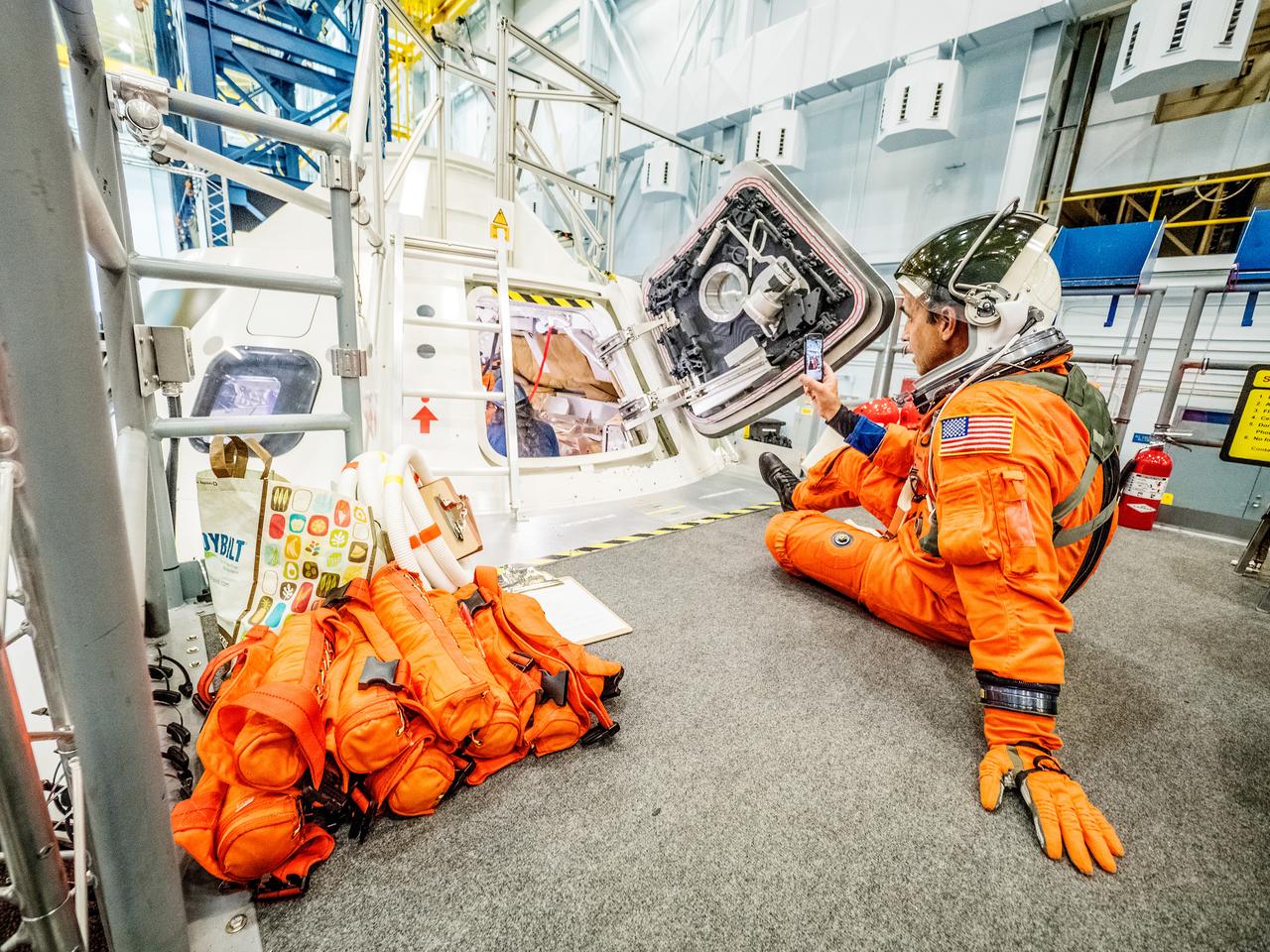 Engineers and astronauts conduct testing in a representative model of the Orion spacecraft at NASA’s Johnson Space Center in Houston on July 28, 2016 to gather the crew's feedback on the design of the docking hatch and on post-landing equipment operations. ..While the crew will primarily use the side hatch for entry and exit on Earth and the docking hatch to travel between Orion and a habitation module on long-duration deep space missions, the crew will need to be able to exit out of the docking hatch if wave heights in the Pacific Ocean upon splashdown are too high. The work is being done to help ensure all elements of Orion's design are safe and effective for the crew to use on future missions on the journey to Mars.