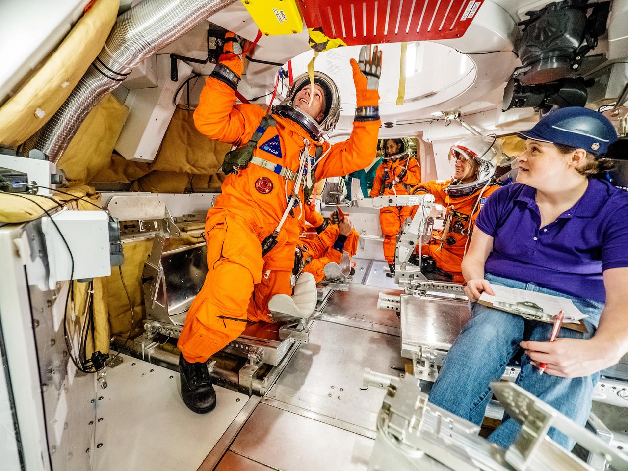 Engineers and astronauts conduct testing in a representative model of the Orion spacecraft at NASA’s Johnson Space Center in Houston on July 28, 2016 to gather the crew's feedback on the design of the docking hatch and on post-landing equipment operations. ..While the crew will primarily use the side hatch for entry and exit on Earth and the docking hatch to travel between Orion and a habitation module on long-duration deep space missions, the crew will need to be able to exit out of the docking hatch if wave heights in the Pacific Ocean upon splashdown are too high. The work is being done to help ensure all elements of Orion's design are safe and effective for the crew to use on future missions on the journey to Mars.