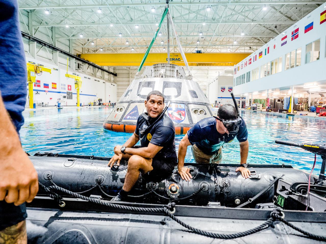 A group of U.S. Navy divers, Air Force pararescumen and Coast Guard rescue swimmers practice Orion underway recovery techniques this week in the Neutral Buoyancy Laboratory (NBL) at NASA’s Johnson Space Center in Houston on Sept. 21, 2016, to prepare for the first test flight of an uncrewed Orion spacecraft with the agency’s Space Launch System rocket during Artemis I. Part of Batch image transfer from Flickr.