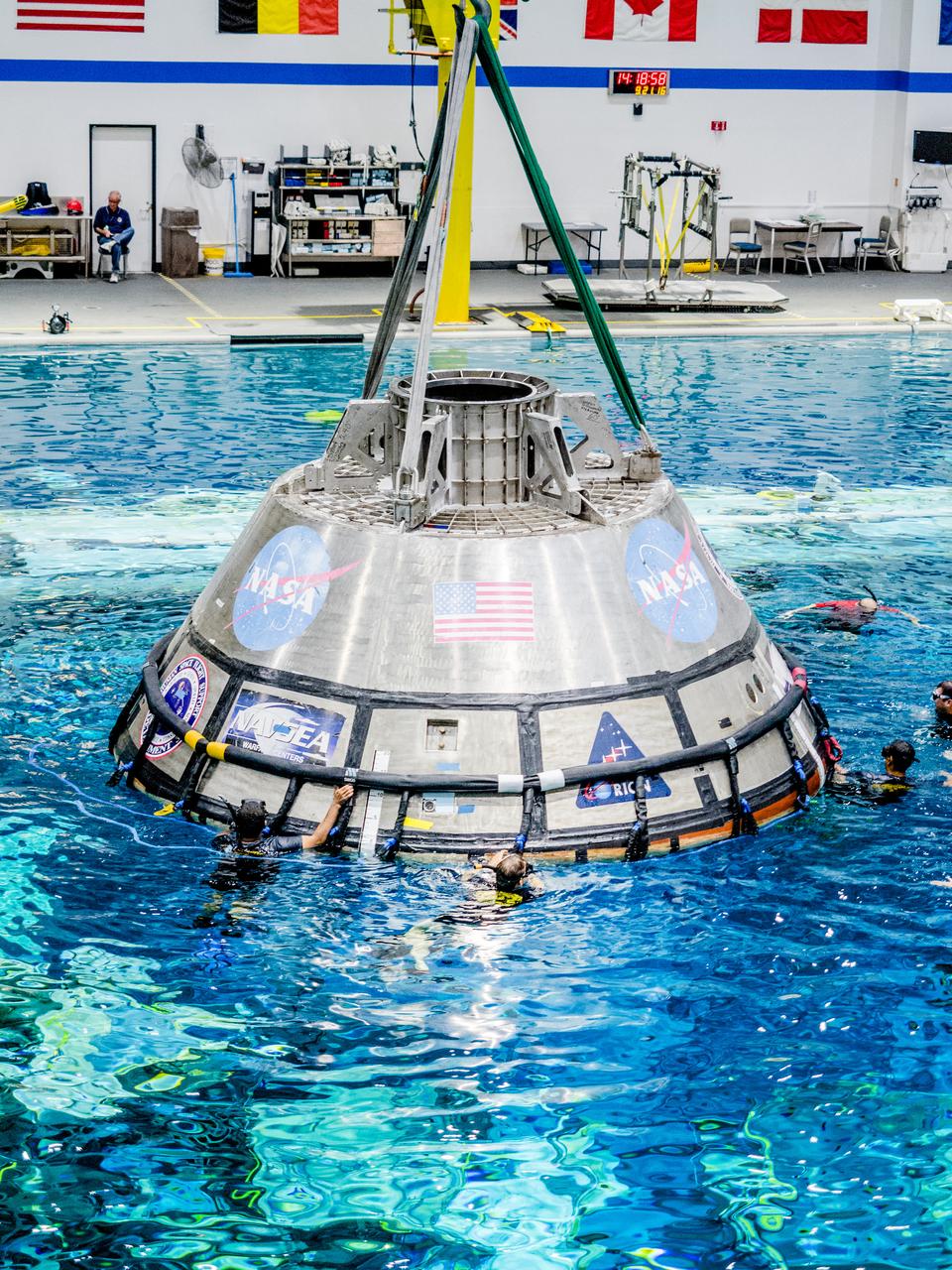 A group of U.S. Navy divers, Air Force pararescumen and Coast Guard rescue swimmers practice Orion underway recovery techniques this week in the Neutral Buoyancy Laboratory (NBL) at NASA’s Johnson Space Center in Houston on Sept. 21, 2016, to prepare for the first test flight of an uncrewed Orion spacecraft with the agency’s Space Launch System rocket during Artemis I.