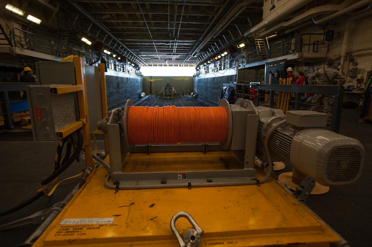 A test version of the Orion crew module is secured in the well deck of the USS San Diego for Underway Recovery Test 5 on Oct. 26, 2016. NASA's Ground Systems Development and Operations Program and the U.S. Navy will conduct a series of tests using the ship's well deck, the test module, various watercraft and equipment to prepare for recovery of Orion on its return from deep space missions. The test will allow the team to demonstrate and evaluate recovery processes, procedures, hardware and personnel in open waters. Part of Batch images transfer from Flickr. 