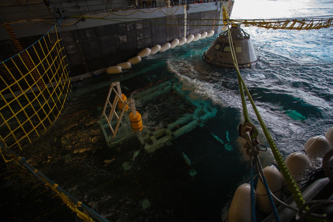 A test version of the Orion crew module is secured in the well deck of the USS San Diego for Underway Recovery Test 5 on Oct. 26, 2016. NASA's Ground Systems Development and Operations Program and the U.S. Navy will conduct a series of tests using the ship's well deck, the test module, various watercraft and equipment to prepare for recovery of Orion on its return from deep space missions. The test will allow the team to demonstrate and evaluate recovery processes, procedures, hardware and personnel in open waters. Part of Batch images transfer from Flickr. 