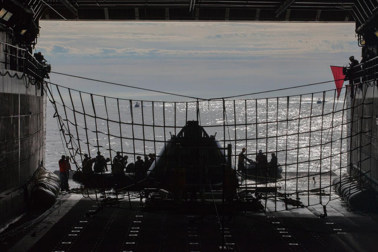 NASA's Ground Systems Development and Operations Program and the U.S. Navy prepare for another day of Underway Recovery Test 5 in the Pacific Ocean off the coast of California on Oct. 30, 2016. A test version of the Orion crew module is in the well deck of the ship, and U.S. Navy divers and other personnel are in rigid hull inflatable boats preparing to head out into the open water. The recovery team is conducting a series of tests to prepare for recovery of Orion on its return from deep space missions. The testing will allow the team to demonstrate and evaluate recovery processes, procedures, hardware and personnel in open waters. Part of Batch images transfer from Flickr. 