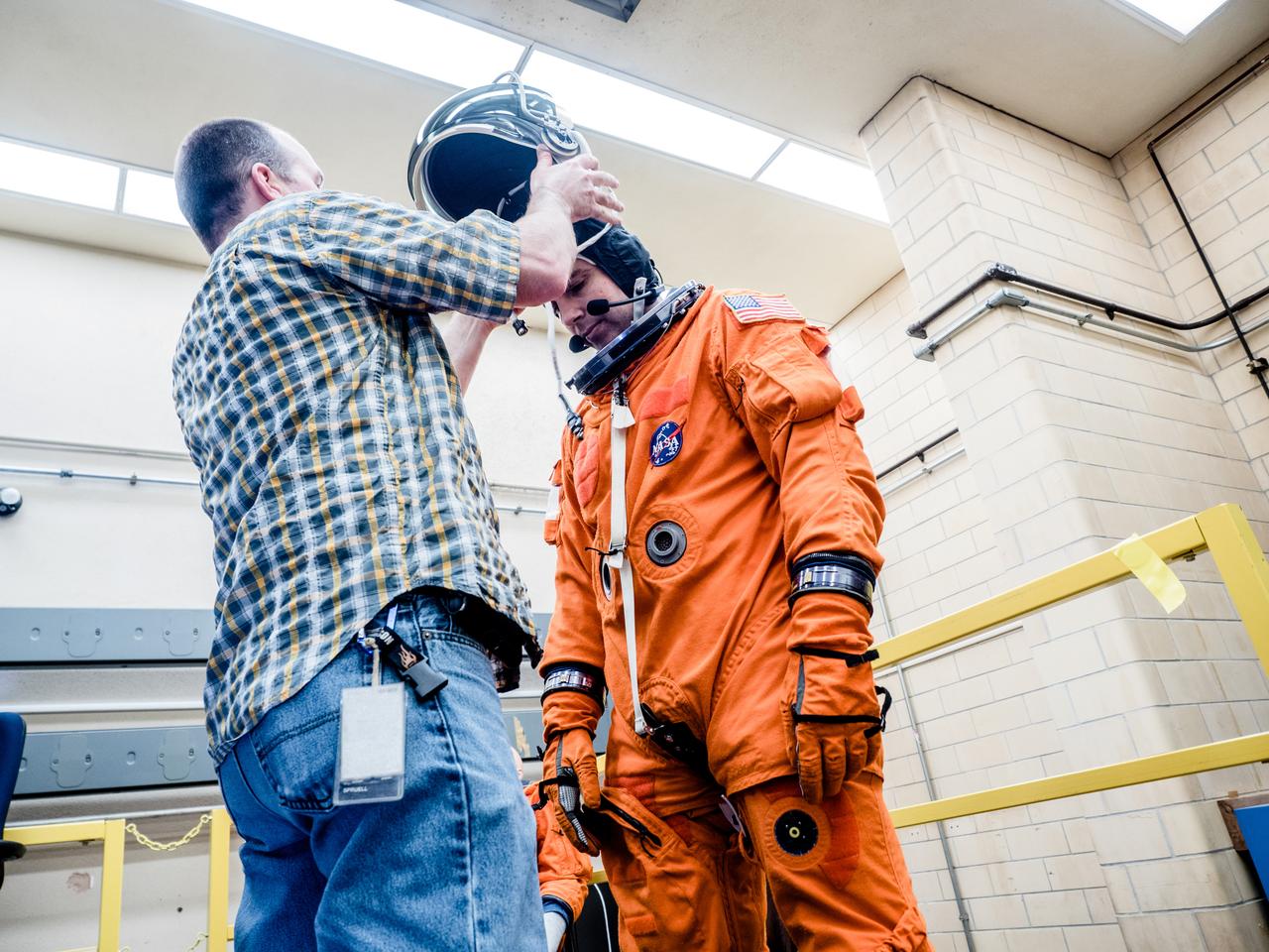 In a lab at NASA’s Johnson Space Center in Houston, engineers simulate conditions that astronauts in space suits would experience when the Orion spacecraft is vibrating during launch atop the agency’s powerful Space Launch System rocket on its way to deep space destinations on Jan. 19, 2017. A series of tests occurring this month at Johnson will help human factors engineers assess how well the crew can interact with the displays and controls they will use to monitor Orion’s systems and operate the spacecraft when necessary...Test subjects wore modified advanced crew escape suits that are being developed for astronauts in Orion, and sat in the latest design of the seat atop the crew impact attenuation system. This was the first time this key hardware was brought together to evaluate how launch vibrations may impact the astronaut’s ability to view the displays and controls.
