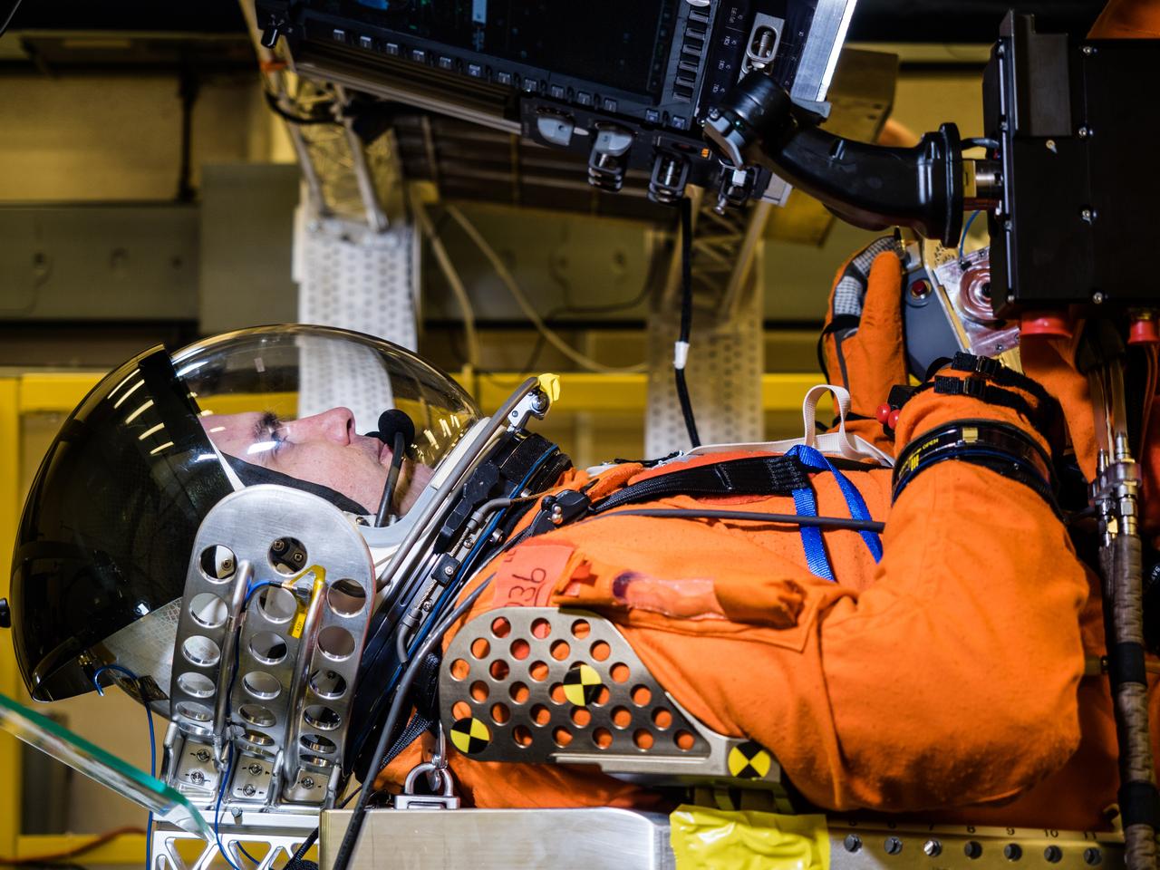 In a lab at NASA’s Johnson Space Center in Houston, engineers simulate conditions that astronauts in space suits would experience when the Orion spacecraft is vibrating during launch atop the agency’s powerful Space Launch System rocket on its way to deep space destinations on Jan. 19, 2017. A series of tests occurring this month at Johnson will help human factors engineers assess how well the crew can interact with the displays and controls they will use to monitor Orion’s systems and operate the spacecraft when necessary...Test subjects wore modified advanced crew escape suits that are being developed for astronauts in Orion, and sat in the latest design of the seat atop the crew impact attenuation system. This was the first time this key hardware was brought together to evaluate how launch vibrations may impact the astronaut’s ability to view the displays and controls.