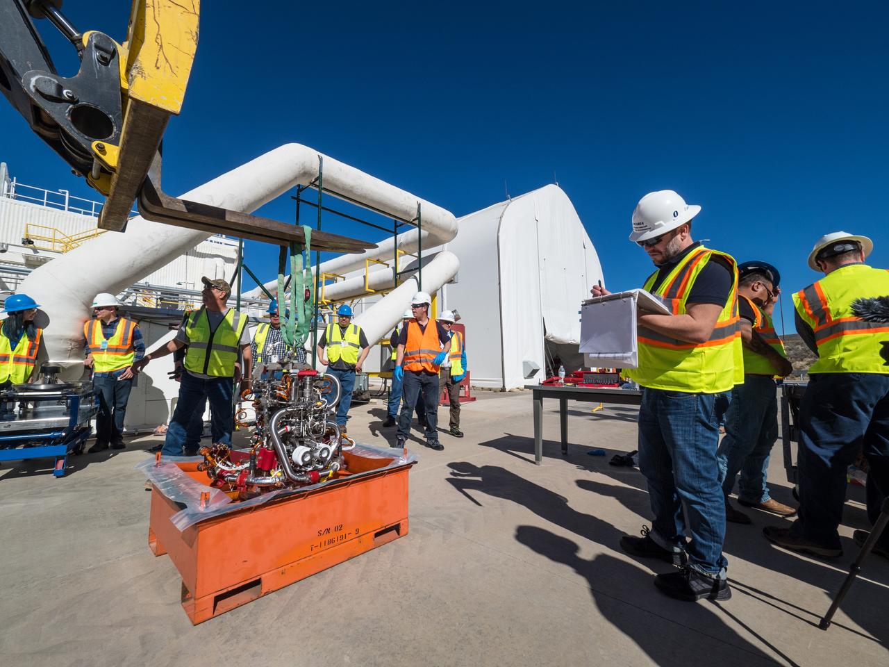 On Feb. 21, 2017 engineers successfully install ESA’s European Service Module Propulsion Qualification Module (PQM) at NASA’s White Sands Test Facility in New Mexico that was delivered by Airbus – ESA’s prime contractor for the Service Module. The module will be equipped with a total of 21 engines to support NASA’s Orion spacecraft: one U.S. Space Shuttle Orbital Maneuvering System (OMS) engine, eight auxiliary thrusters and 12 smaller thrusters produced by Airbus Safran Launchers in Germany. The all-steel PQM structure is used to test the propulsion systems on Orion, including “hot firing” of the OMS engine and thrusters.