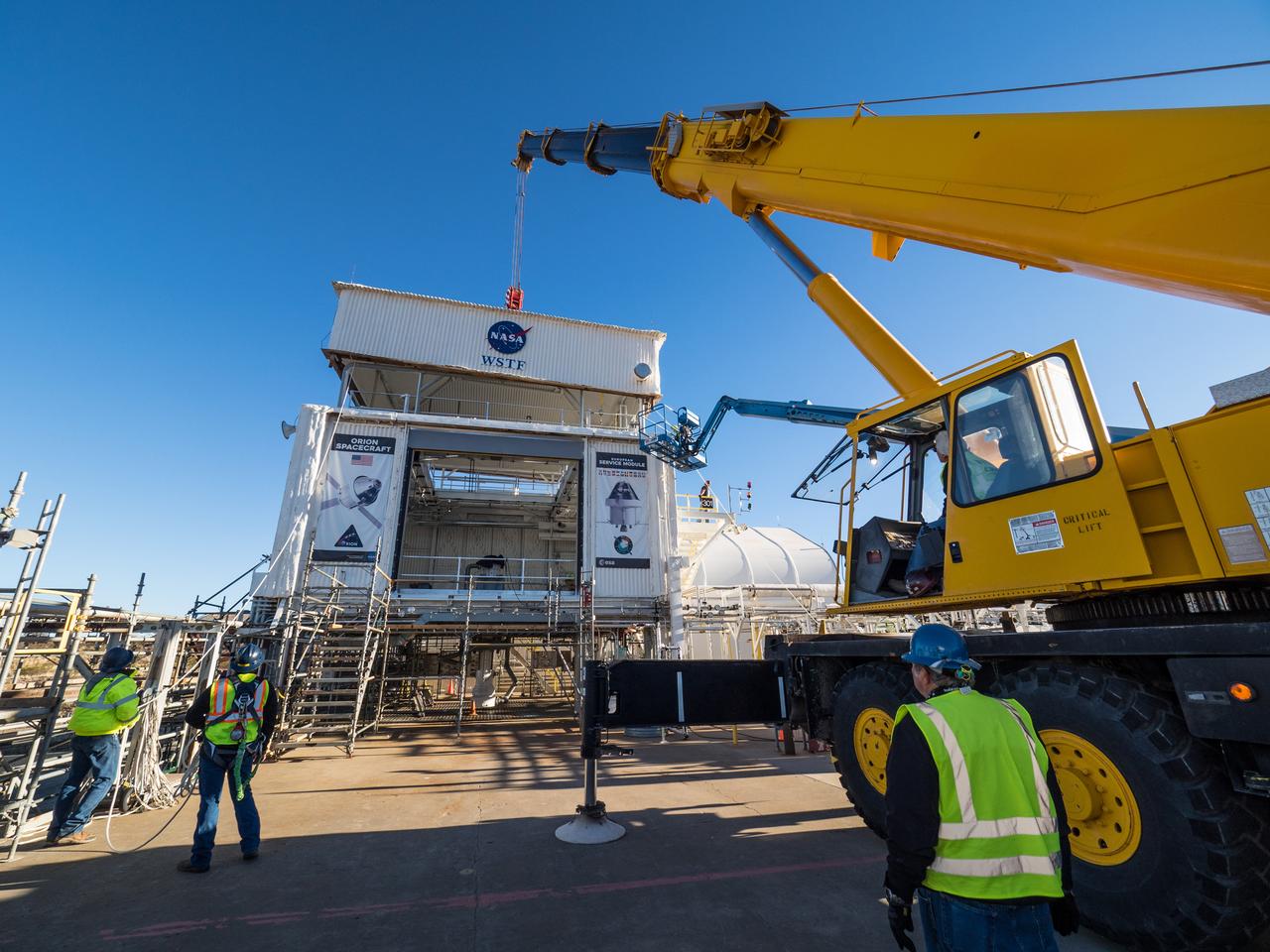 On Feb. 21, 2017 engineers successfully install ESA’s European Service Module Propulsion Qualification Module (PQM) at NASA’s White Sands Test Facility in New Mexico that was delivered by Airbus – ESA’s prime contractor for the Service Module. The module will be equipped with a total of 21 engines to support NASA’s Orion spacecraft: one U.S. Space Shuttle Orbital Maneuvering System (OMS) engine, eight auxiliary thrusters and 12 smaller thrusters produced by Airbus Safran Launchers in Germany. The all-steel PQM structure is used to test the propulsion systems on Orion, including “hot firing” of the OMS engine and thrusters.