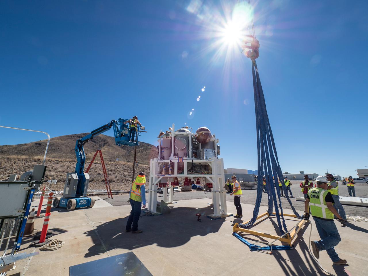 On Feb. 22, engineers successfully install ESA’s European Service Module Propulsion Qualification Module (PQM) at NASA’s White Sands Test Facility in New Mexico that was delivered by Airbus – ESA’s prime contractor for the Service Module. The module will be equipped with a total of 21 engines to support NASA’s Orion spacecraft: one U.S. Space Shuttle Orbital Maneuvering System (OMS) engine, eight auxiliary thrusters and 12 smaller thrusters produced by Airbus Safran Launchers in Germany. The all-steel PQM structure is used to test the propulsion systems on Orion, including “hot firing” of the OMS engine and thrusters.