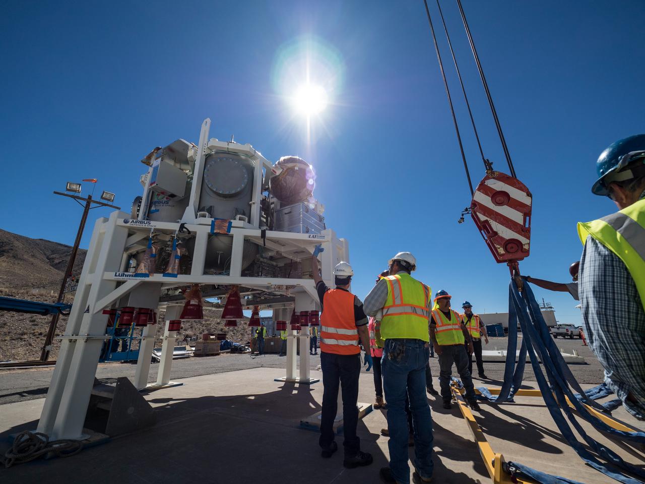 On Feb. 22, engineers successfully install ESA’s European Service Module Propulsion Qualification Module (PQM) at NASA’s White Sands Test Facility in New Mexico that was delivered by Airbus – ESA’s prime contractor for the Service Module. The module will be equipped with a total of 21 engines to support NASA’s Orion spacecraft: one U.S. Space Shuttle Orbital Maneuvering System (OMS) engine, eight auxiliary thrusters and 12 smaller thrusters produced by Airbus Safran Launchers in Germany. The all-steel PQM structure is used to test the propulsion systems on Orion, including “hot firing” of the OMS engine and thrusters.