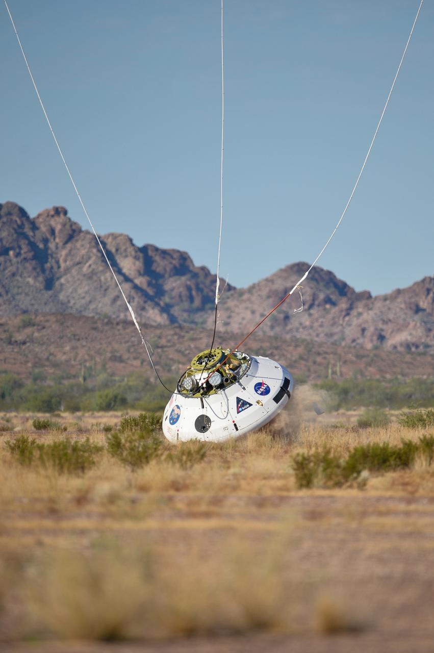 Engineers testing the parachute system for Orion during a Sept. 13, 2017 evaluation at the U.S. Army Proving Ground in Yuma.. .During this test, engineers replicated a situation in which Orion must abort off the Space Launch System rocket and bypasses part of its normal parachute deployment sequence that typically helps the spacecraft slow down during its descent to Earth after deep space missions. The capsule was dropped out of a C-17 aircraft at more than 4.7 miles in altitude and allowed to free fall for 20 seconds, longer than ever before, to produce high aerodynamic pressure before only its pilot and main parachutes were deployed, testing whether they could perform as expected under extreme loads. Orion’s full parachute system includes 11 total parachutes -- three forward bay cover parachutes and two drogue parachutes, along with three pilot parachutes that help pull out the spacecraft’s three mains.
