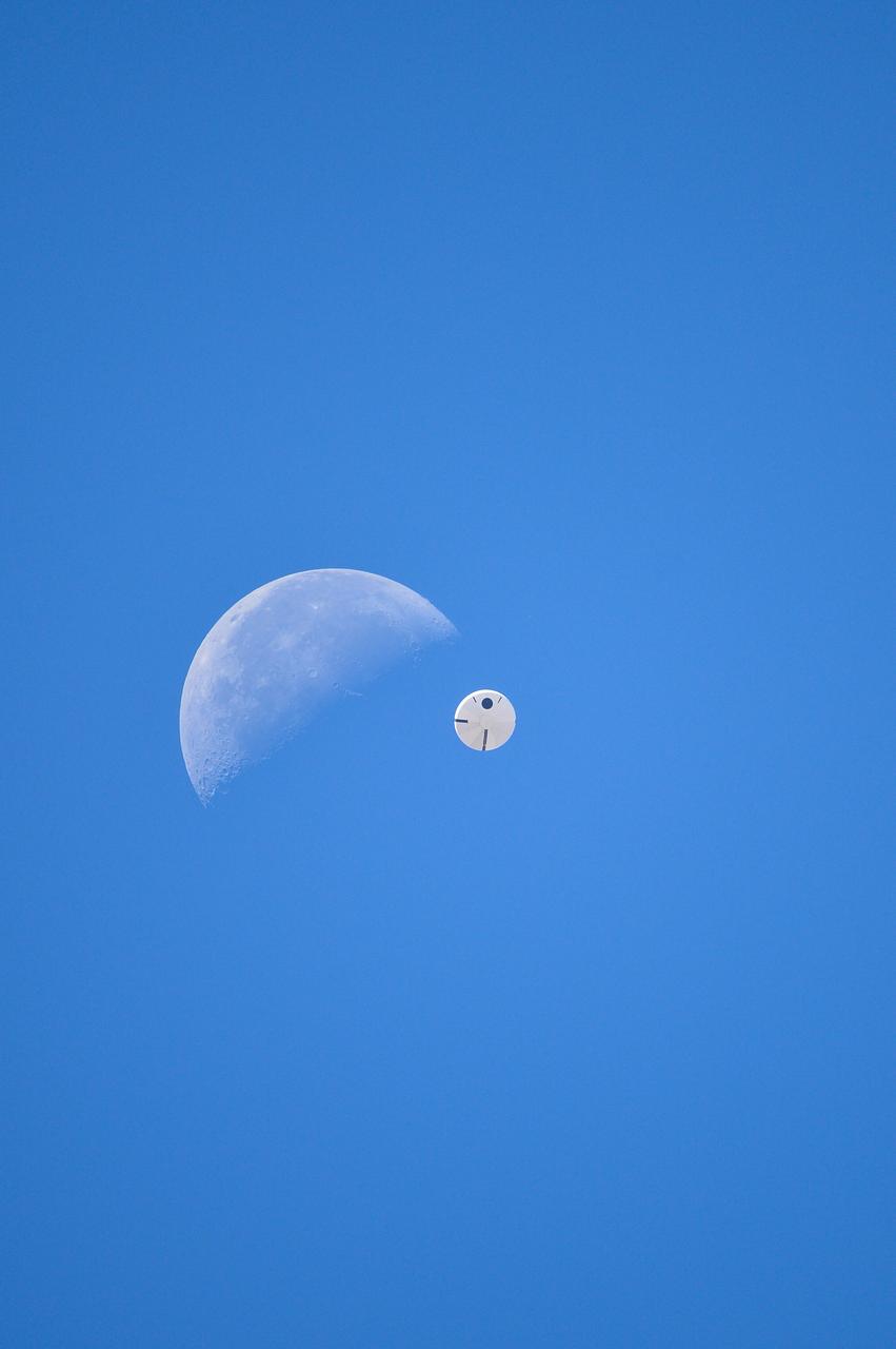 Orion’s three main orange and white parachutes help a representative model of the spacecraft descend through sky above Arizona, where NASA engineers tested the parachute system on Sept. 13, 2017 at the U.S. Army Proving Ground in Yuma. NASA is qualifying Orion’s parachutes for missions with astronauts.. .During this test, engineers replicated a situation in which Orion must abort off the Space Launch System rocket and bypasses part of its normal parachute deployment sequence that typically helps the spacecraft slow down during its descent to Earth after deep space missions. The capsule was dropped out of a C-17 aircraft at more than 4.7 miles in altitude and allowed to free fall for 20 seconds, longer than ever before, to produce high aerodynamic pressure before only its pilot and main parachutes were deployed, testing whether they could perform as expected under extreme loads. Orion’s full parachute system includes 11 total parachutes -- three forward bay cover parachutes and two drogue parachutes, along with three pilot parachutes that help pull out the spacecraft’s three mains.