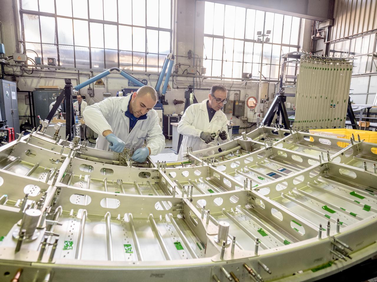 While engineers in Europe continue to outfit the Orion spacecraft’s service module for Artemis I in preparation for shipment to NASA’s Kennedy Space Center in Florida next year, work is already beginning on the service module that will power, propel, cool and provide air and water for the first crewed mission in the Orion spacecraft in the early 2020s. On Sept. 19, 2017, technicians at Thales Alenia in Turin, Italy, work on the primary structure of the European Service Module that will carry astronauts in Orion beyond the Moon during Artemis II. ESA (European Space Agency) and its contractors are providing Orion’s service module for its first two missions atop the Space Launch System rocket. NASA is leading the next steps in human space exploration and will send astronauts to the vicinity of the Moon to build and test the systems needed for challenging missions to deep space destinations including Mars. NASA is working with domestic and international partners to solve the great challenges of deep space exploration.