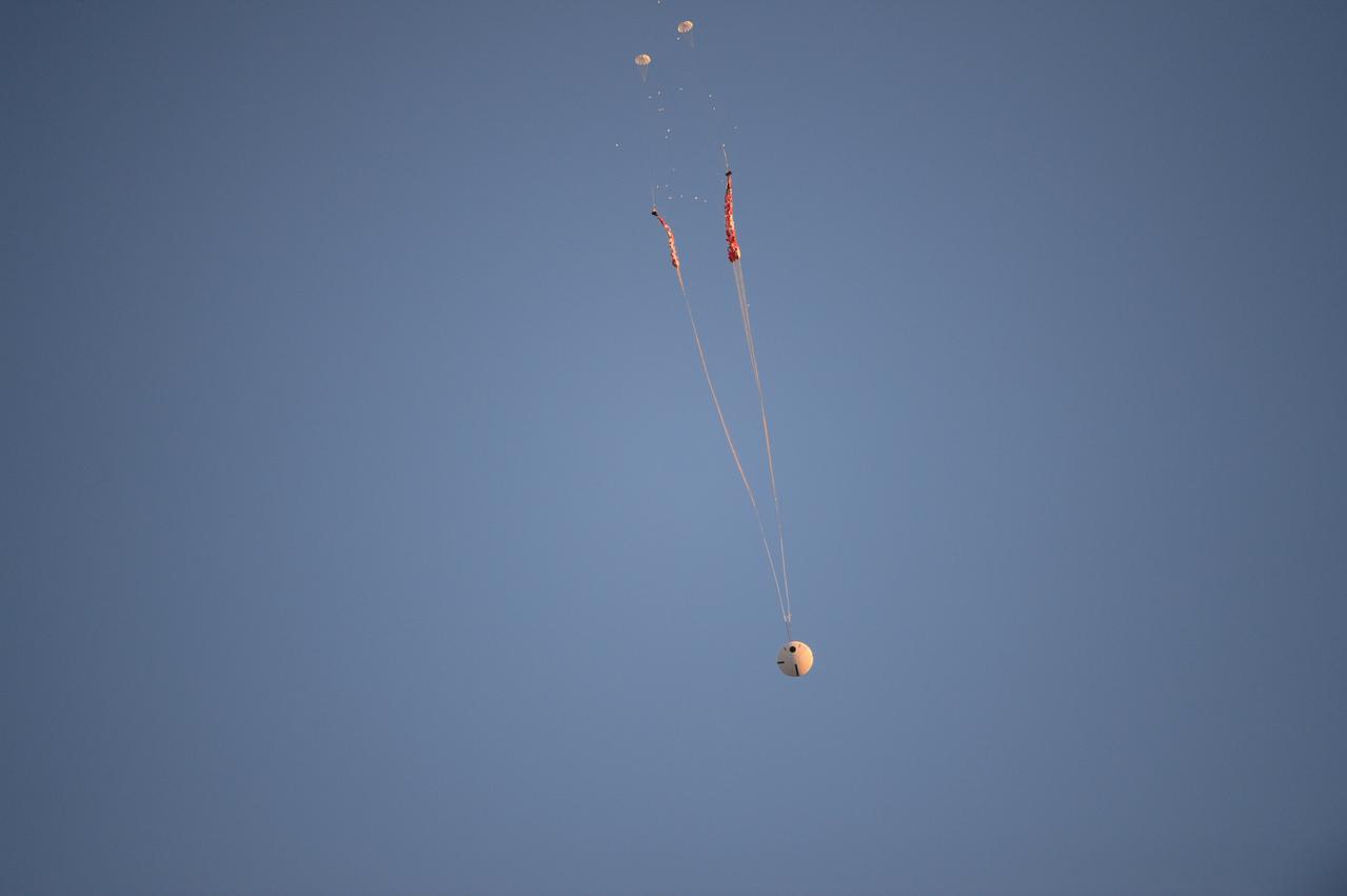 Engineers successfully evaluated a failure scenario of Orion’s parachute system in which only two of the system’s three orange and white main parachutes deploy after several other parachutes in the system used to slow and stabilize Orion endure high aerodynamic stresses ahead of a safe landing. The test occurred Dec. 15, 2017 at the U.S. Army Proving Ground in Yuma, Arizona. A mock capsule was dropped from a C-17 aircraft at 35,000 feet in altitude to enable the right conditions for the test. It was the fifth of eight tests to qualify Orion’s parachute system for flights with astronauts beginning with Artemis II.