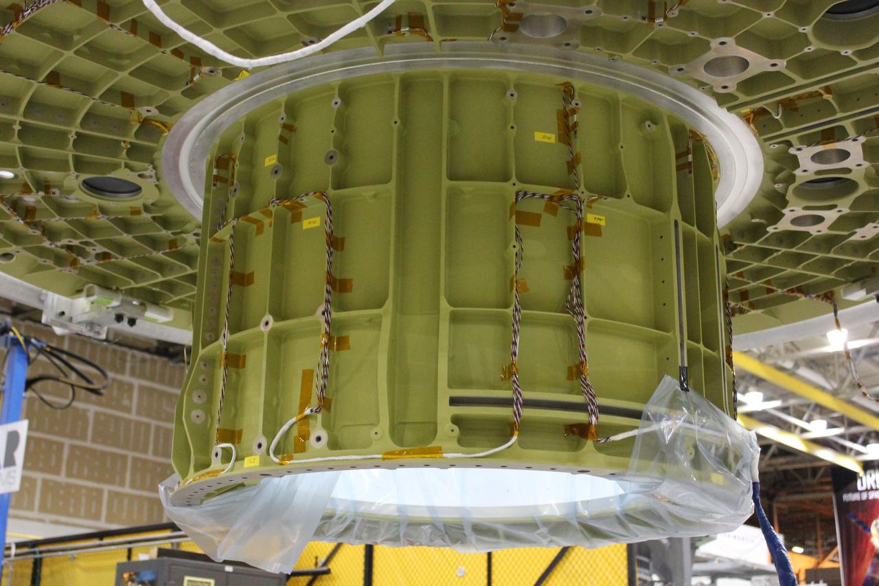 At NASA's Michoud Assembly Facility in Louisiana, Lockheed Martin technicians complete the first weld on the pressure vessel for Orion which will carry humans to deep space on Artemis II on Dec. 21, 2017.