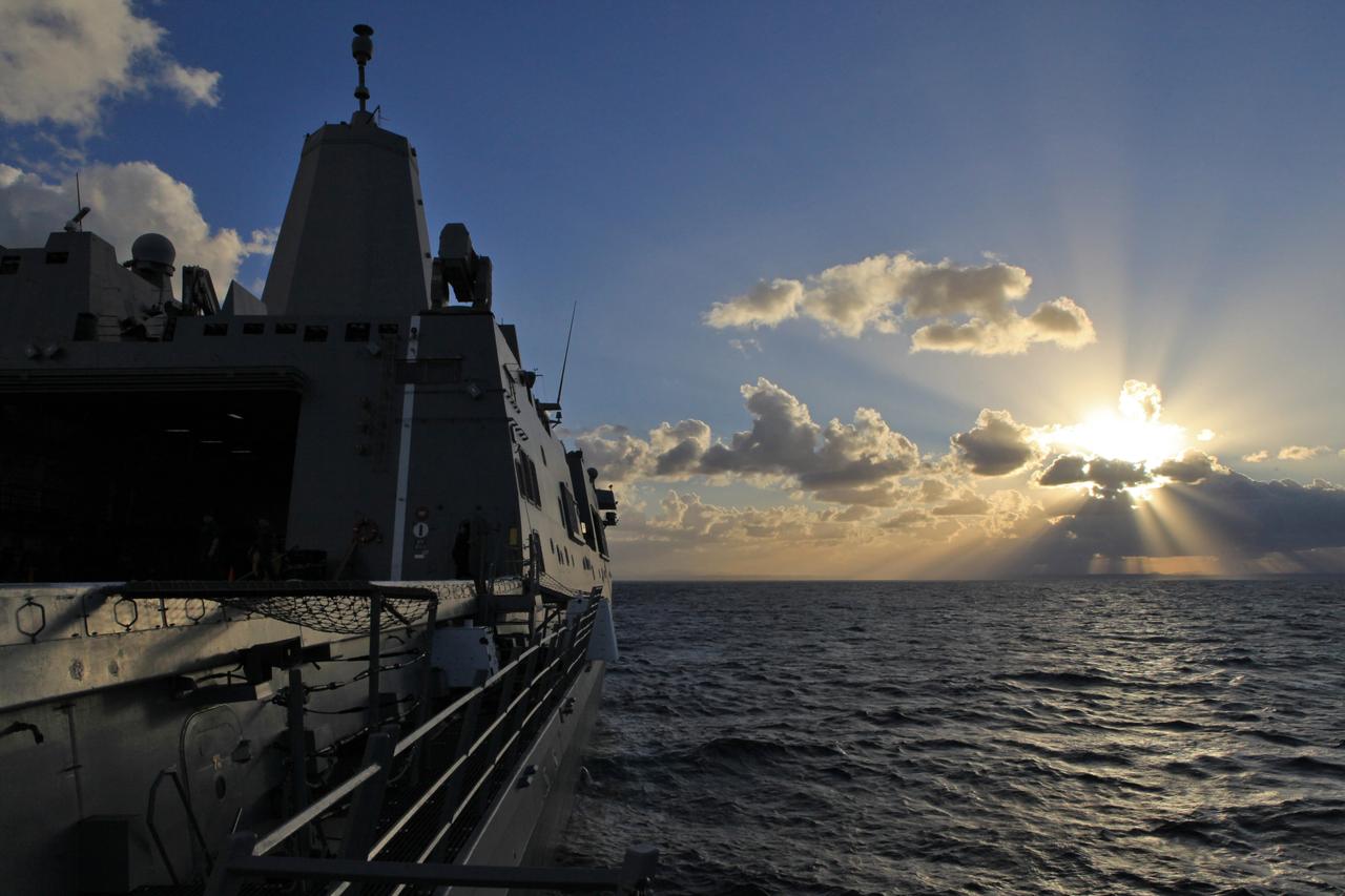 The USS Anchorage sails toward sunrise while Kennedy Space Center’s NASA Recovery Team prepares for another day of testing as part of Underway Recovery Test 6 on Jan. 20, 2018. The testing with the NASA Recovery Team and the U.S. Navy will provide important data that is being used to improve recovery procedures and hardware ahead of Orion's next flight, Artemis I, when it splashes down in the Pacific Ocean.