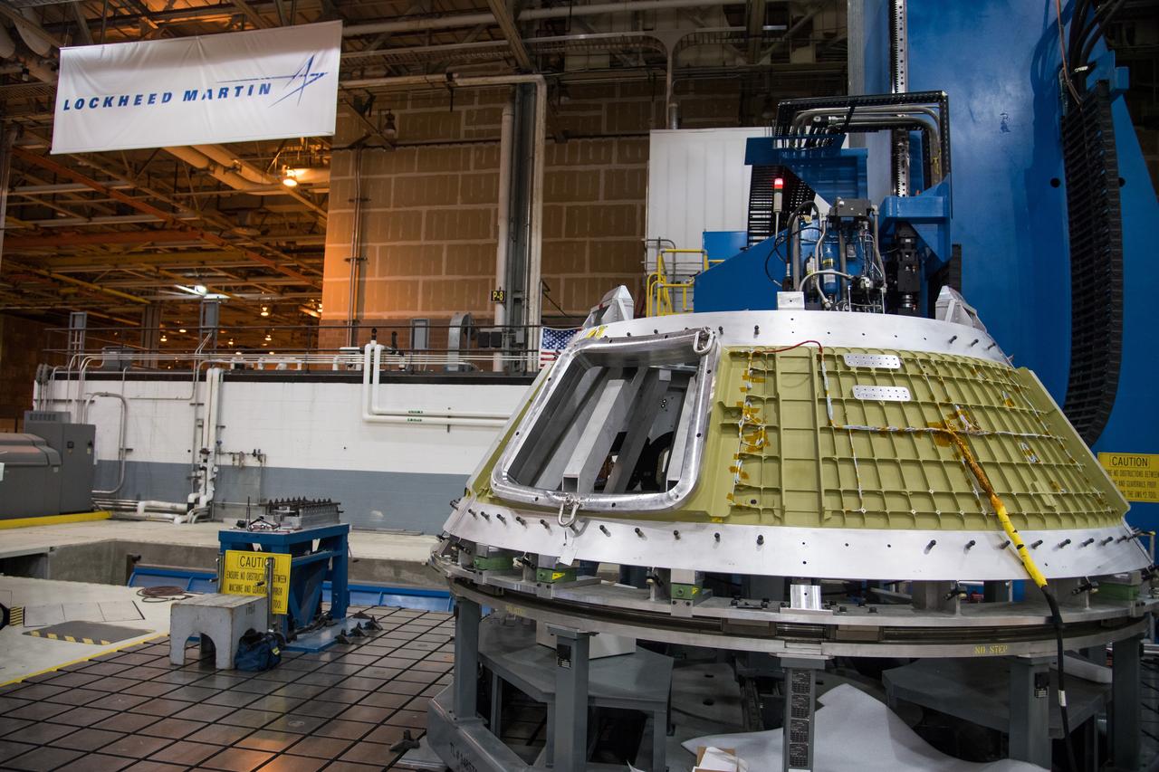 Lockheed Martin engineers at NASA's Michoud Assembly Facility in New Orleans, Louisiana, weld the cone section for the Orion spacecraft which will carry humans beyond the Moon on Artemis II, on Jan. 29, 2018.