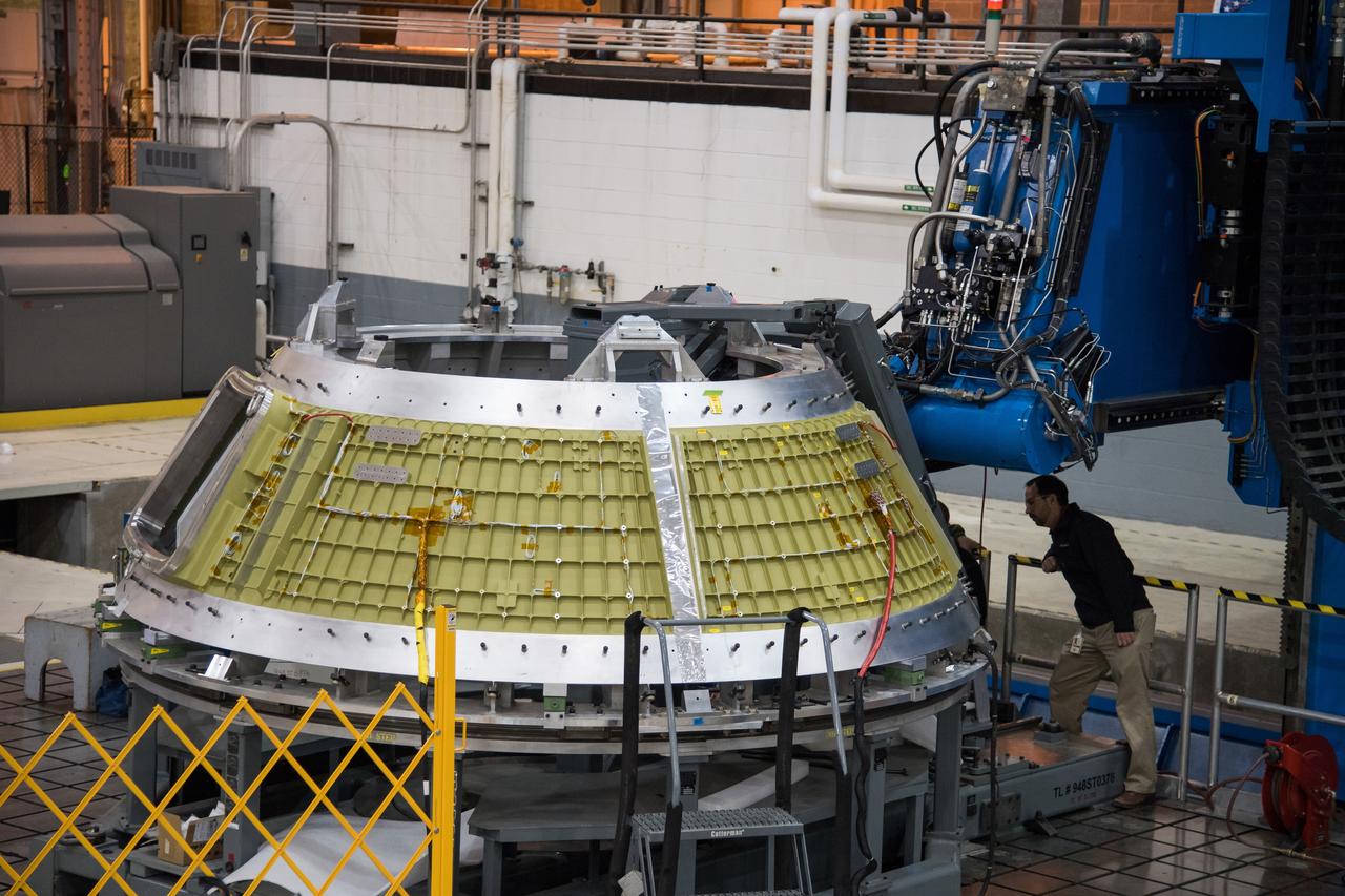 Lockheed Martin engineers at NASA's Michoud Assembly Facility in New Orleans, Louisiana, weld the cone section for the Orion spacecraft which will carry humans beyond the Moon on Artemis II, on Jan. 29, 2018.