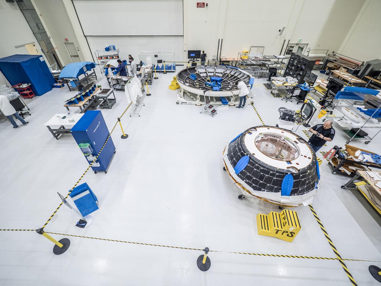 Lockheed Martin engineers assemble Orion's Artemis I crew module at NASA's Kennedy Space Center Operations and Checkout Building on April 27, 2018.