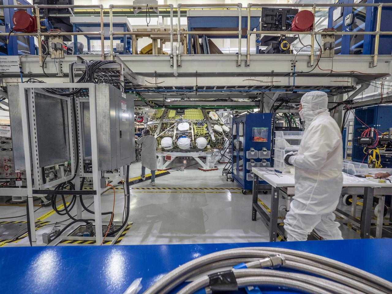 Lockheed Martin engineers assemble Orion's Artemis I crew module at NASA's Kennedy Space Center Operations and Checkout Building on April 27, 2018.