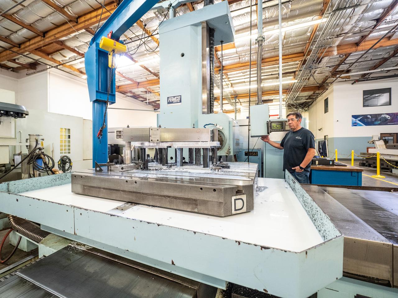 Parts for the Orion crew module which will carry astronauts on Artemis II are machined at Aerospace Engineering Corporation in California on June 18, 2018.