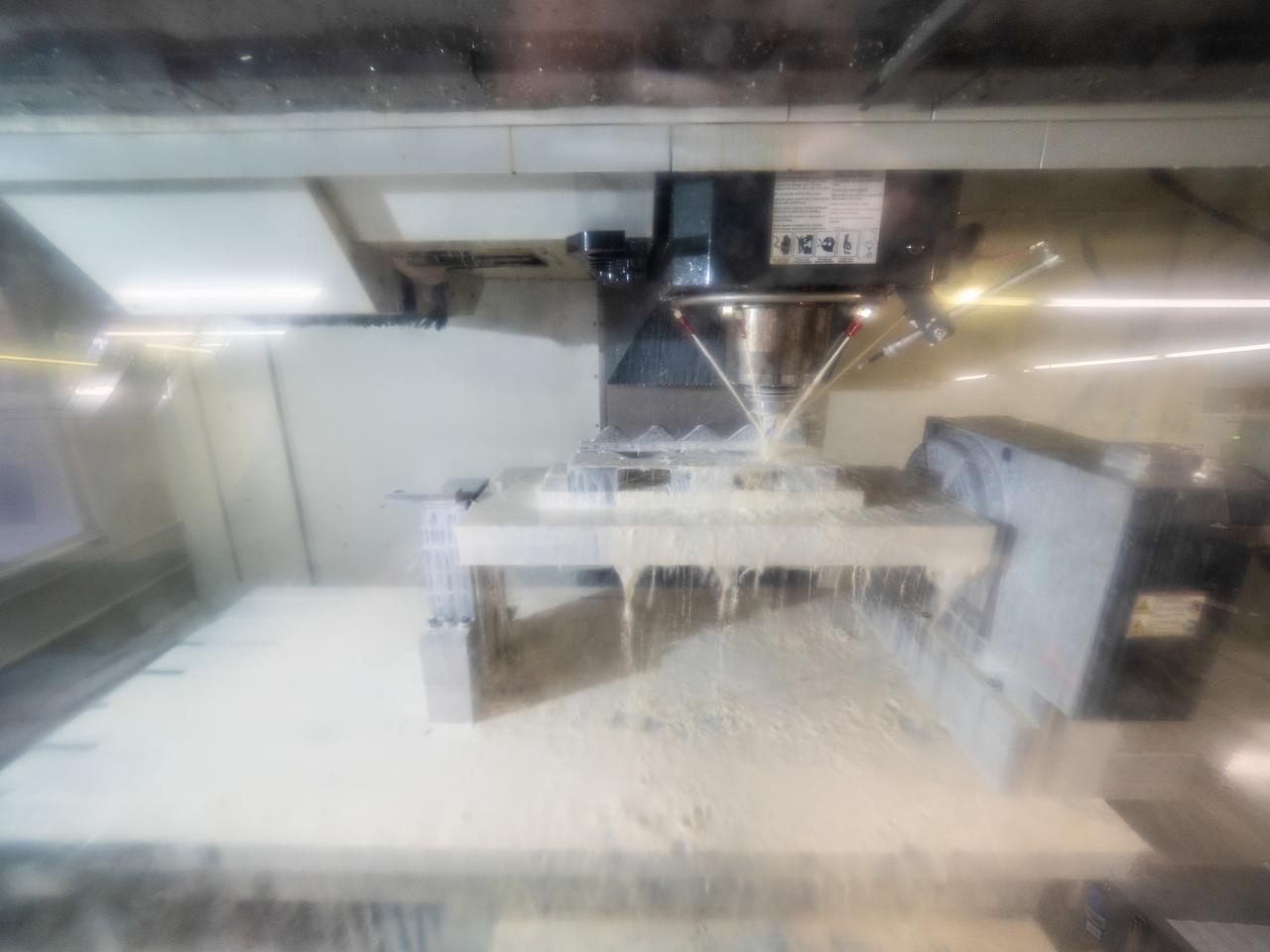 Parts for the Orion crew module which will carry astronauts on Artemis II are machined at Aerospace Engineering Corporation in California on June 18, 2018.