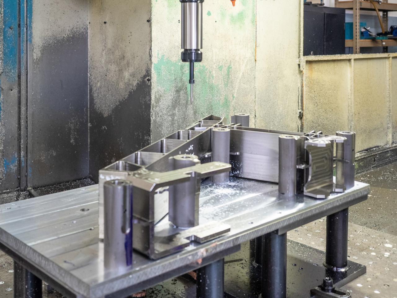 Parts for the Orion crew module which will carry astronauts on Artemis II are machined at Aerospace Engineering Corporation in California on June 18, 2018.