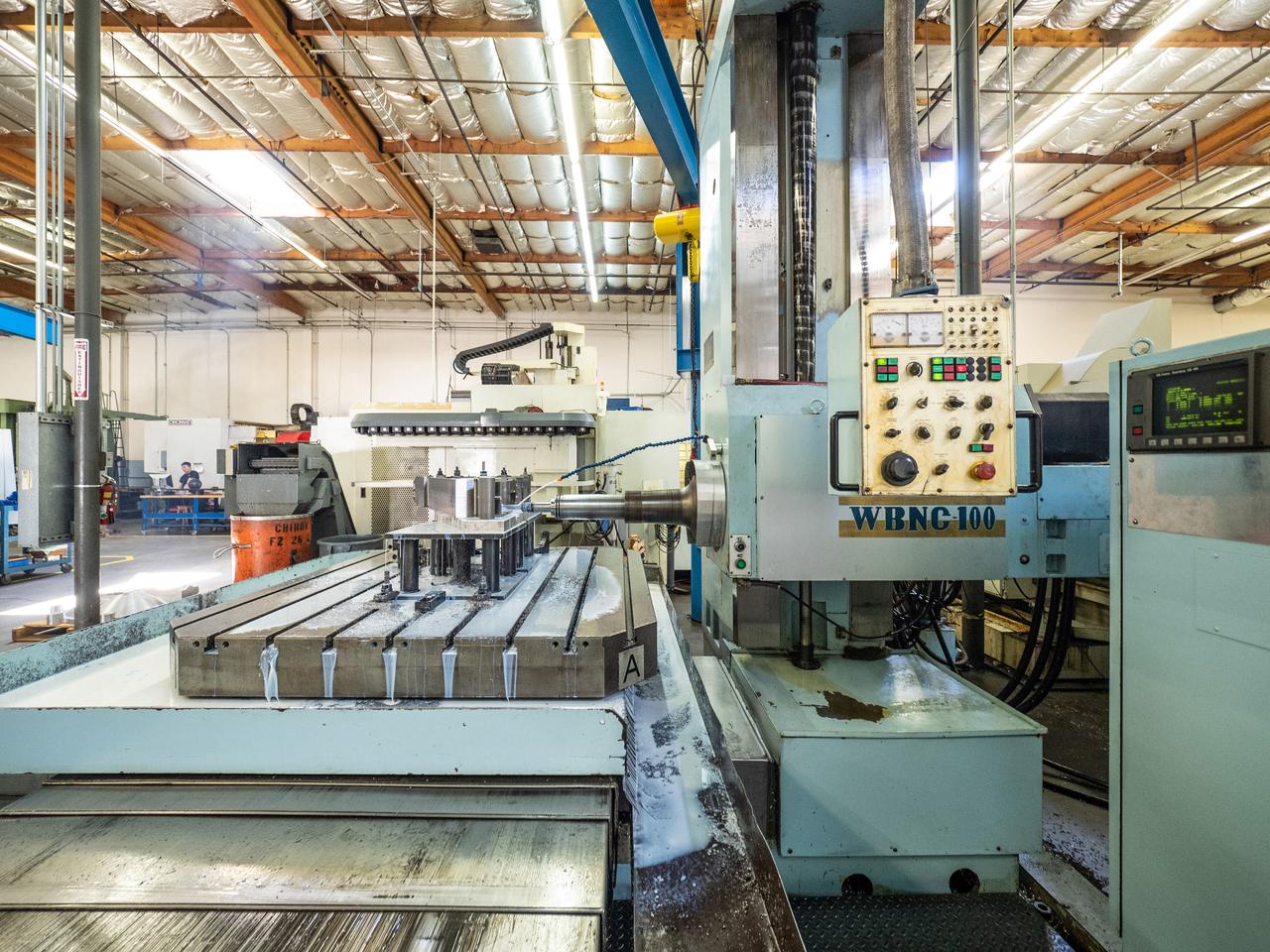 Parts for the Orion crew module which will carry astronauts on Artemis II are machined at Aerospace Engineering Corporation in California on June 18, 2018.