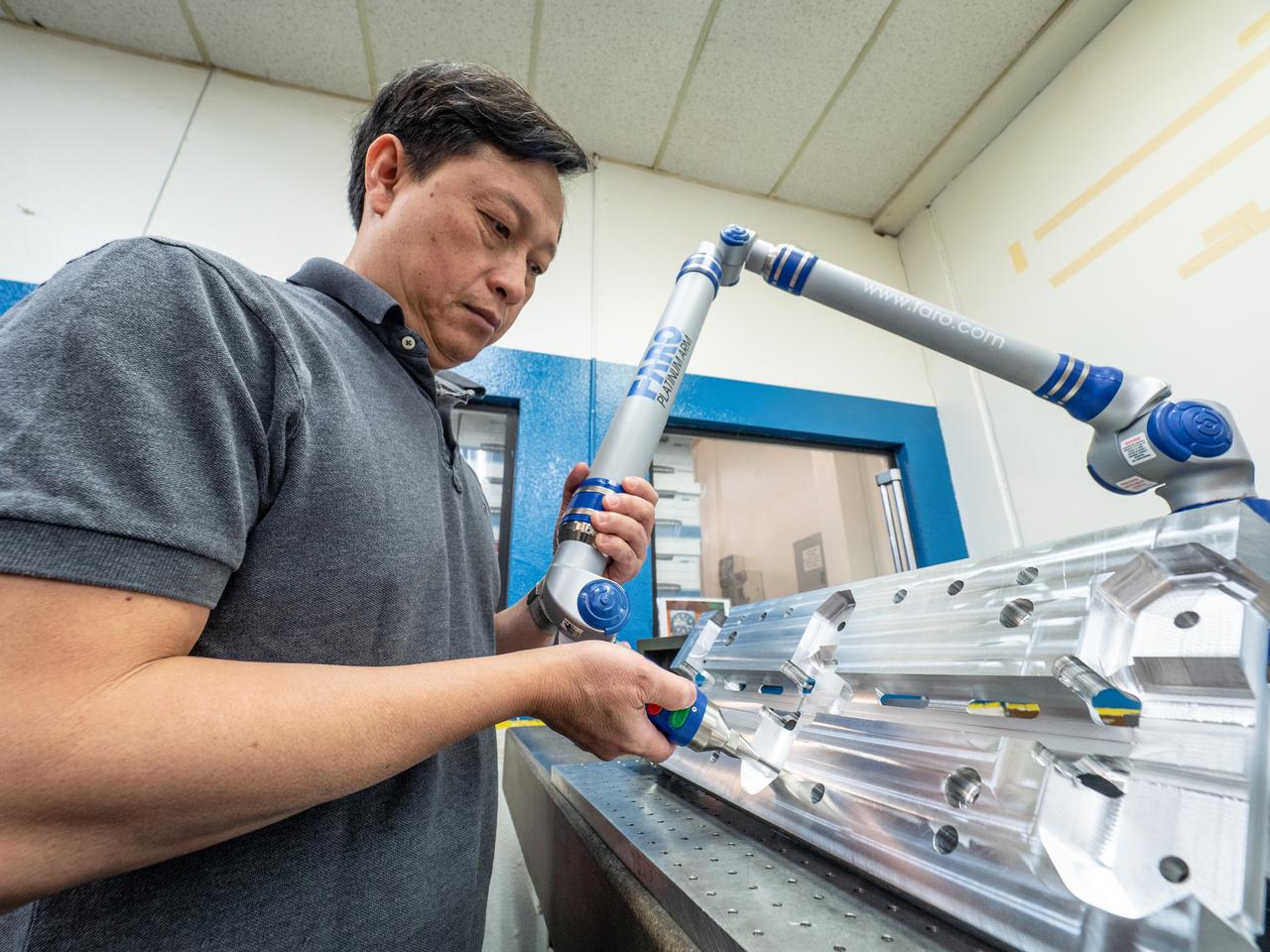 Parts for the Orion crew module which will carry astronauts on Artemis II are machined at Aerospace Engineering Corporation in California on June 18, 2018.