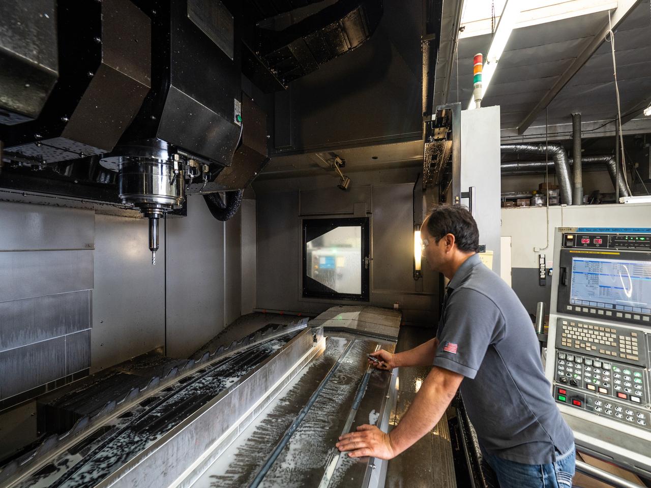 Parts for the Orion crew module which will carry astronauts on Artemis II are machined at Aerospace Engineering Corporation in California on June 18, 2018.