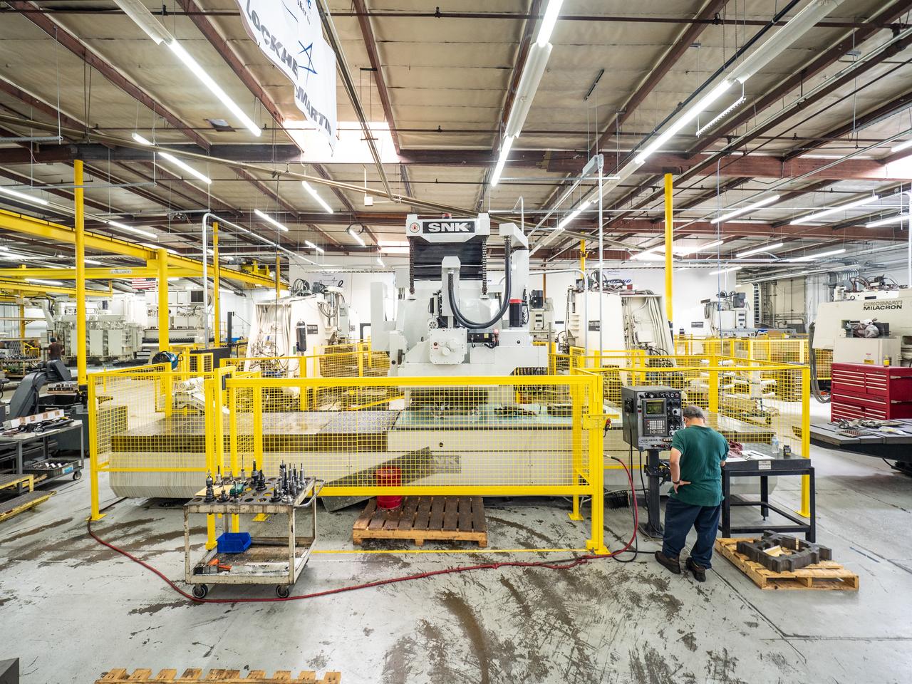 Parts for the Orion crew module which will carry astronauts on Artemis II are machined at Aerospace Engineering Corporation in California on June 18, 2018.