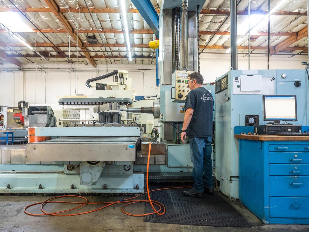 Parts for the Orion crew module which will carry astronauts on Artemis II are machined at Aerospace Engineering Corporation in California on June 18, 2018.