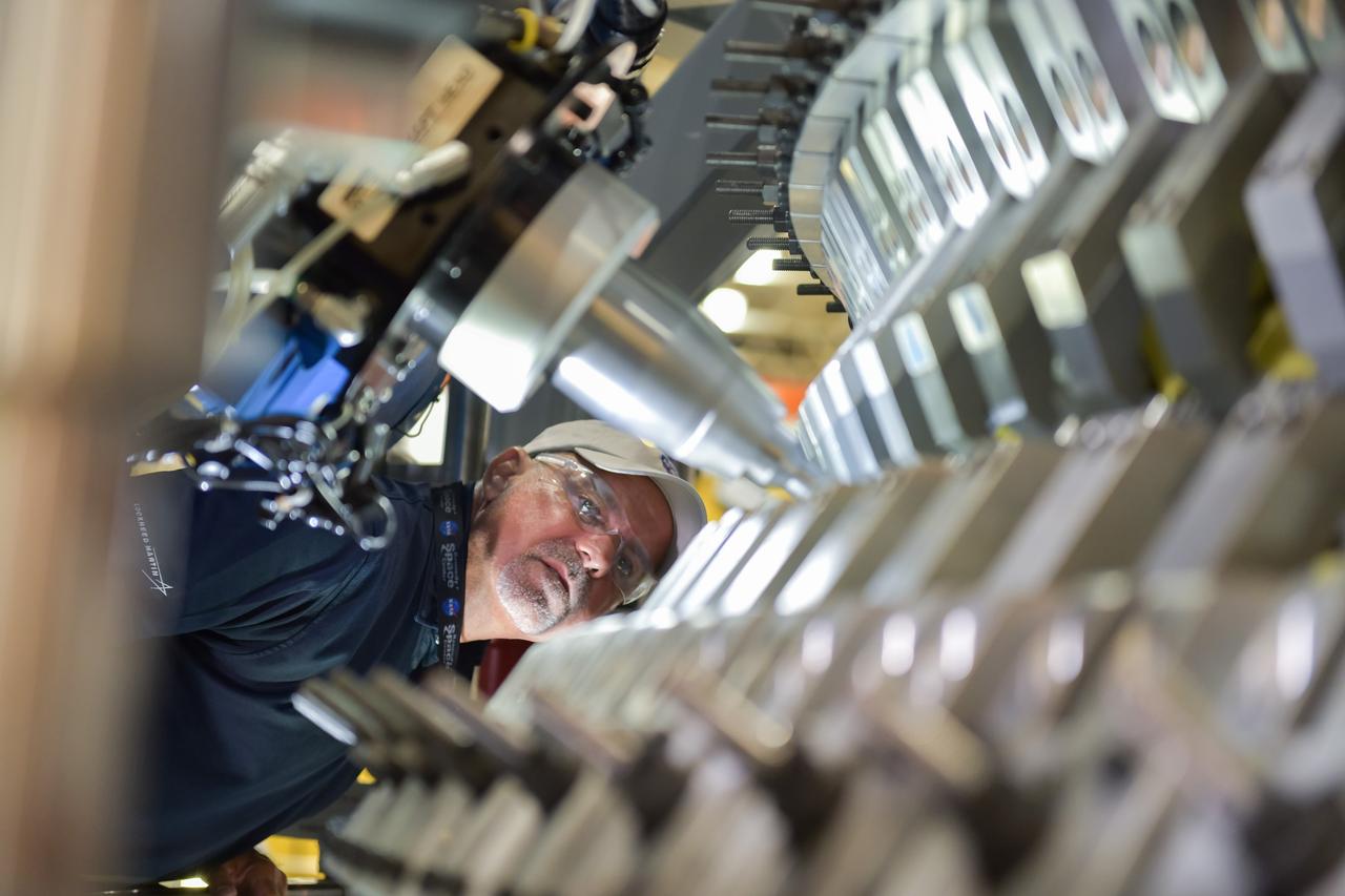 Lockheed Martin technicians at NASA's Michoud Assembly Facility in New Orleans, Louisiana, complete the final weld on the pressure vessel of the Orion crew module for Artemis II on July 24, 2018, the first flight of Orion with astronauts which will carry them farther into the solar system than ever before.