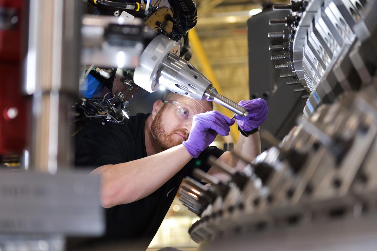 Lockheed Martin technicians at NASA's Michoud Assembly Facility in New Orleans, Louisiana, complete the final weld on the pressure vessel of the Orion crew module for Artemis II on July 24, 2018, the first flight of Orion with astronauts which will carry them farther into the solar system than ever before.