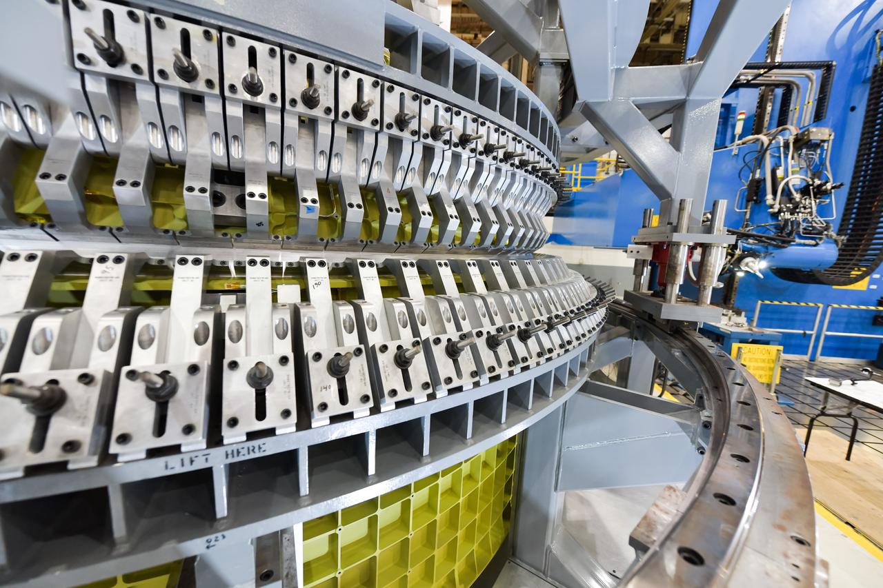 Lockheed Martin technicians at NASA's Michoud Assembly Facility in New Orleans, Louisiana, complete the final weld on the pressure vessel of the Orion crew module for Artemis II on July 24, 2018, the first flight of Orion with astronauts which will carry them farther into the solar system than ever before.