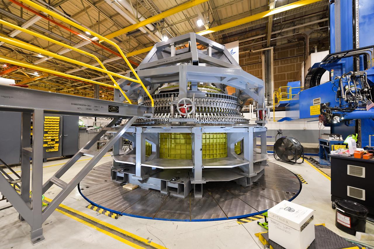 Lockheed Martin technicians at NASA's Michoud Assembly Facility in New Orleans, Louisiana, complete the final weld on the pressure vessel of the Orion crew module for Artemis II on July 24, 2018, the first flight of Orion with astronauts which will carry them farther into the solar system than ever before.