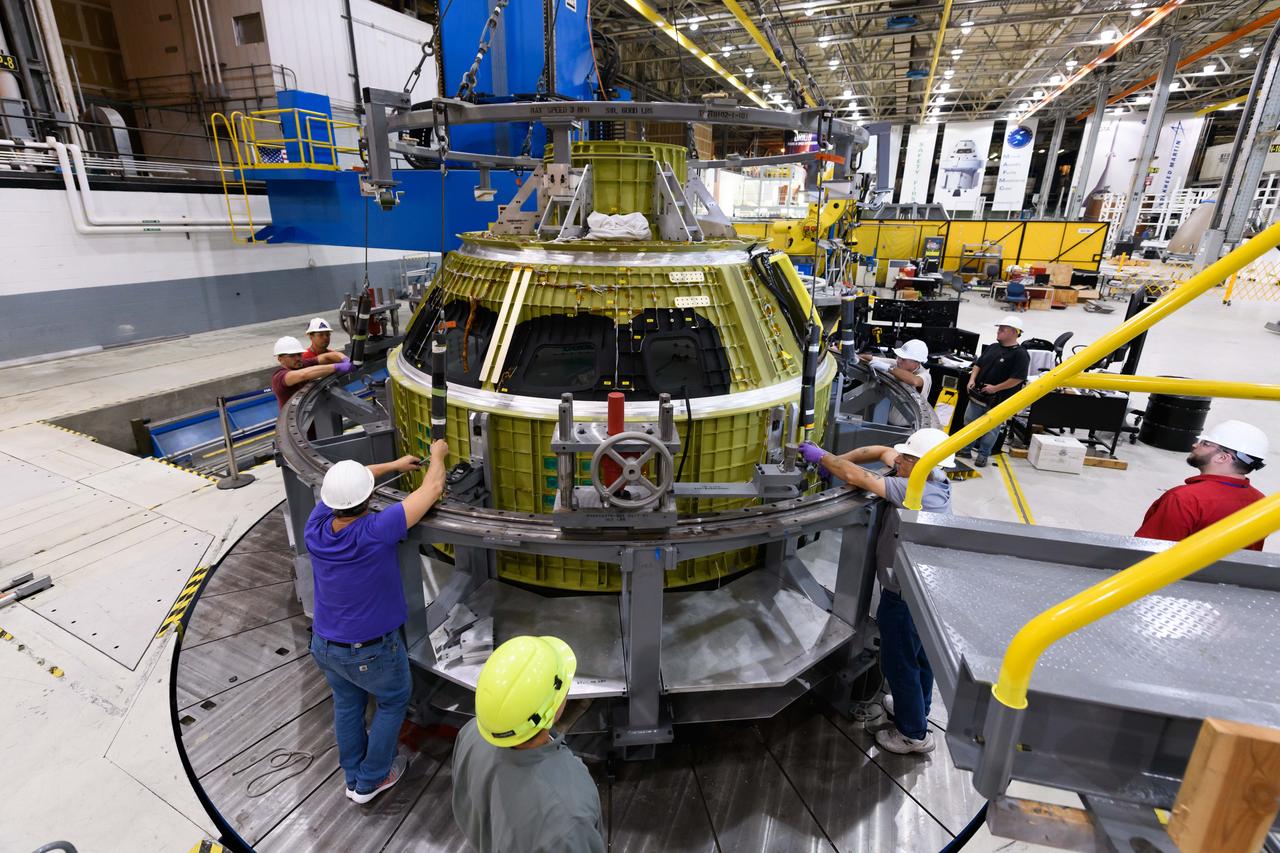 Lockheed Martin technicians at NASA's Michoud Assembly Facility in New Orleans, Louisiana, complete the final weld on the pressure vessel of the Orion crew module for Artemis II on July 24, 2018, the first flight of Orion with astronauts which will carry them farther into the solar system than ever before.