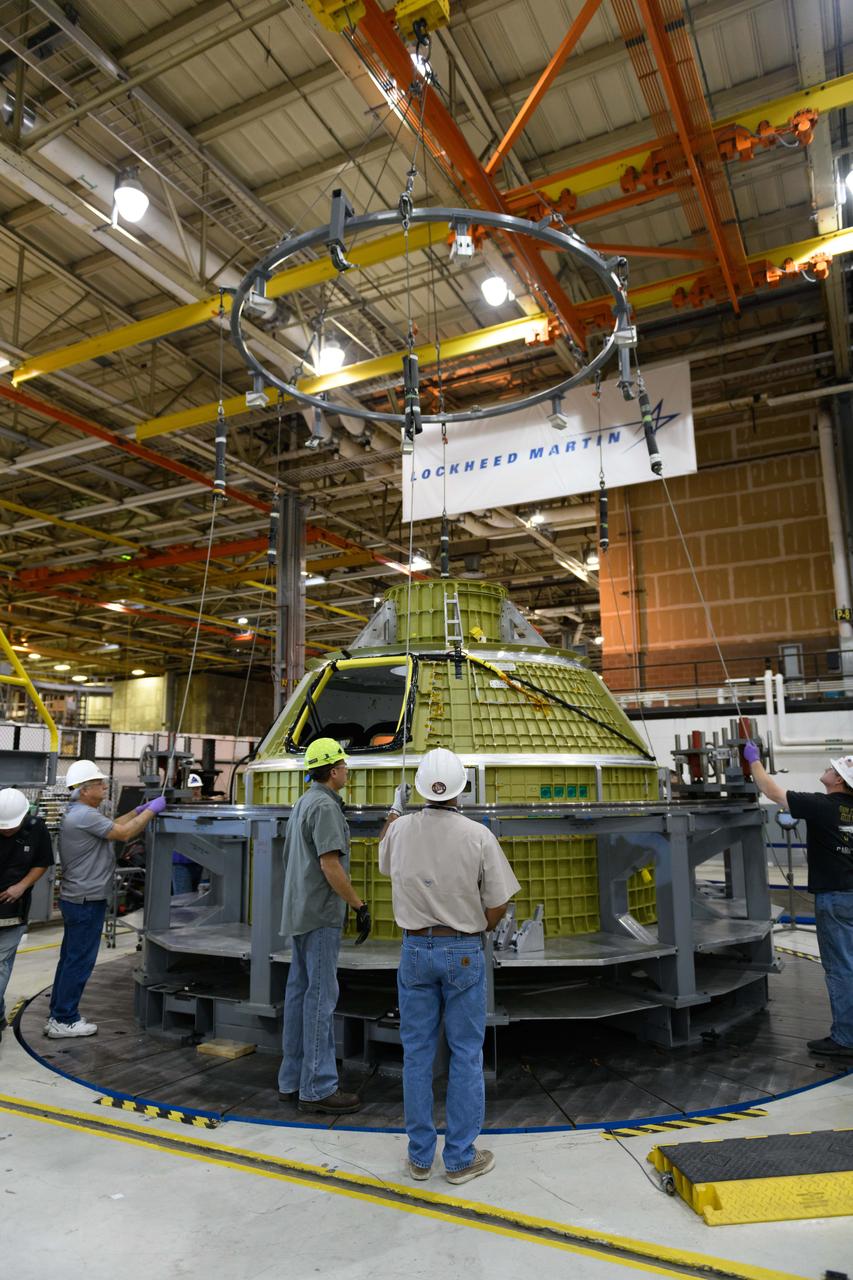 Lockheed Martin technicians at NASA's Michoud Assembly Facility in New Orleans, Louisiana, complete the final weld on the pressure vessel of the Orion crew module for Artemis II on July 24, 2018, the first flight of Orion with astronauts which will carry them farther into the solar system than ever before.