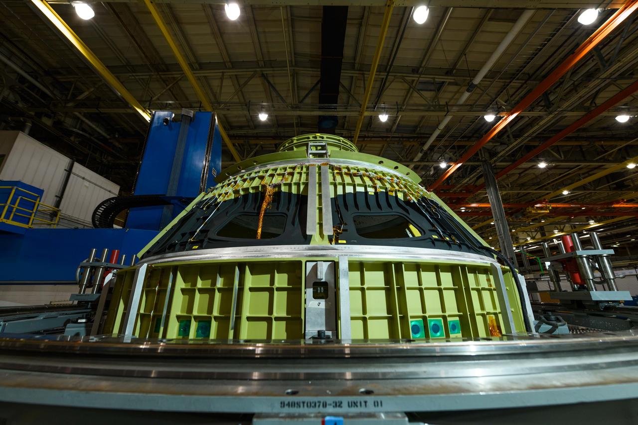 Lockheed Martin technicians at NASA's Michoud Assembly Facility in New Orleans, Louisiana, complete the final weld on the pressure vessel of the Orion crew module for Artemis II on July 24, 2018, the first flight of Orion with astronauts which will carry them farther into the solar system than ever before.