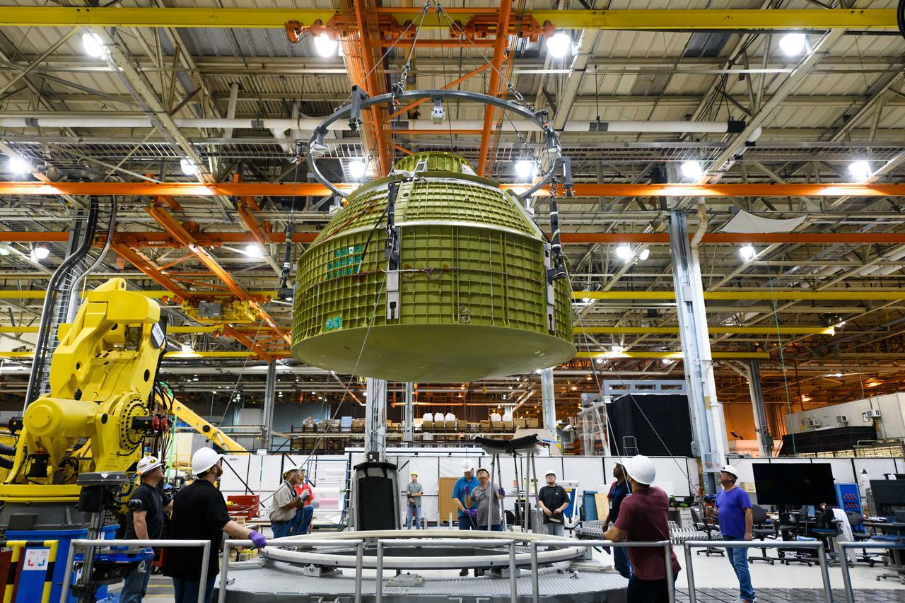 Lockheed Martin technicians at NASA's Michoud Assembly Facility in New Orleans, Louisiana, complete the final weld on the pressure vessel of the Orion crew module for Artemis II on July 24, 2018, the first flight of Orion with astronauts which will carry them farther into the solar system than ever before.