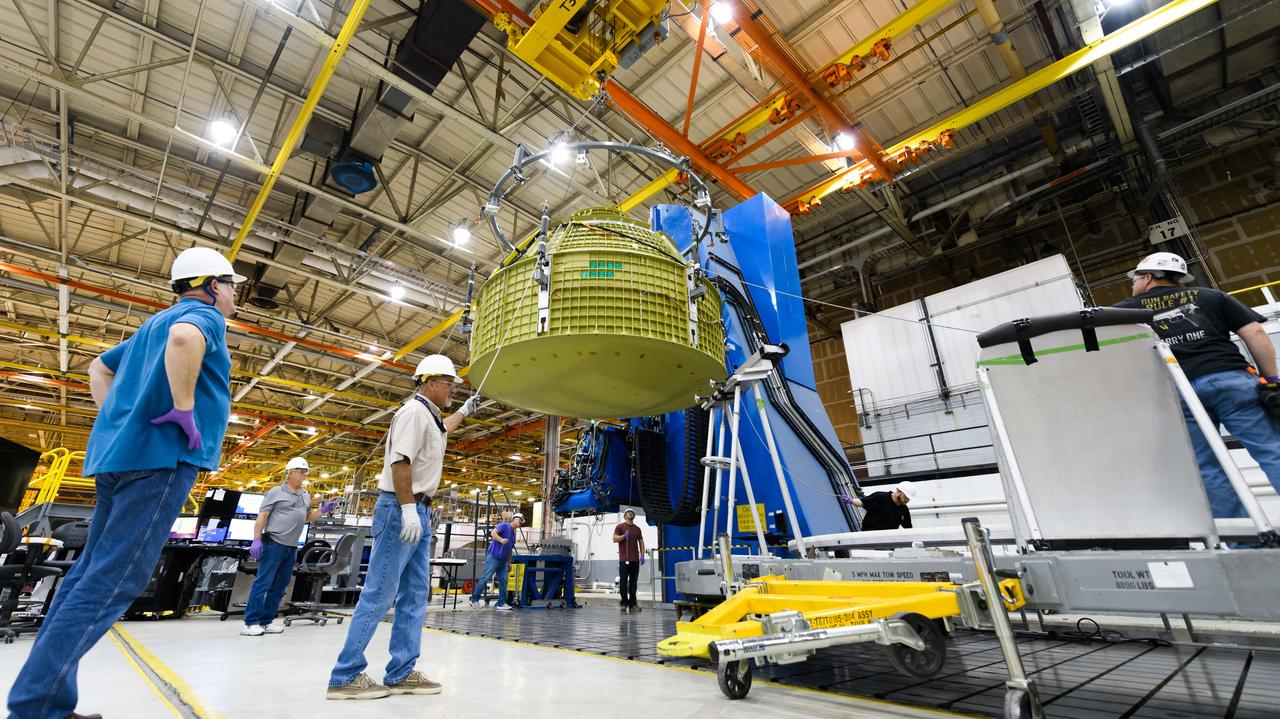 Lockheed Martin technicians at NASA's Michoud Assembly Facility in New Orleans, Louisiana, complete the final weld on the pressure vessel of the Orion crew module for Artemis II on July 24, 2018, the first flight of Orion with astronauts which will carry them farther into the solar system than ever before.