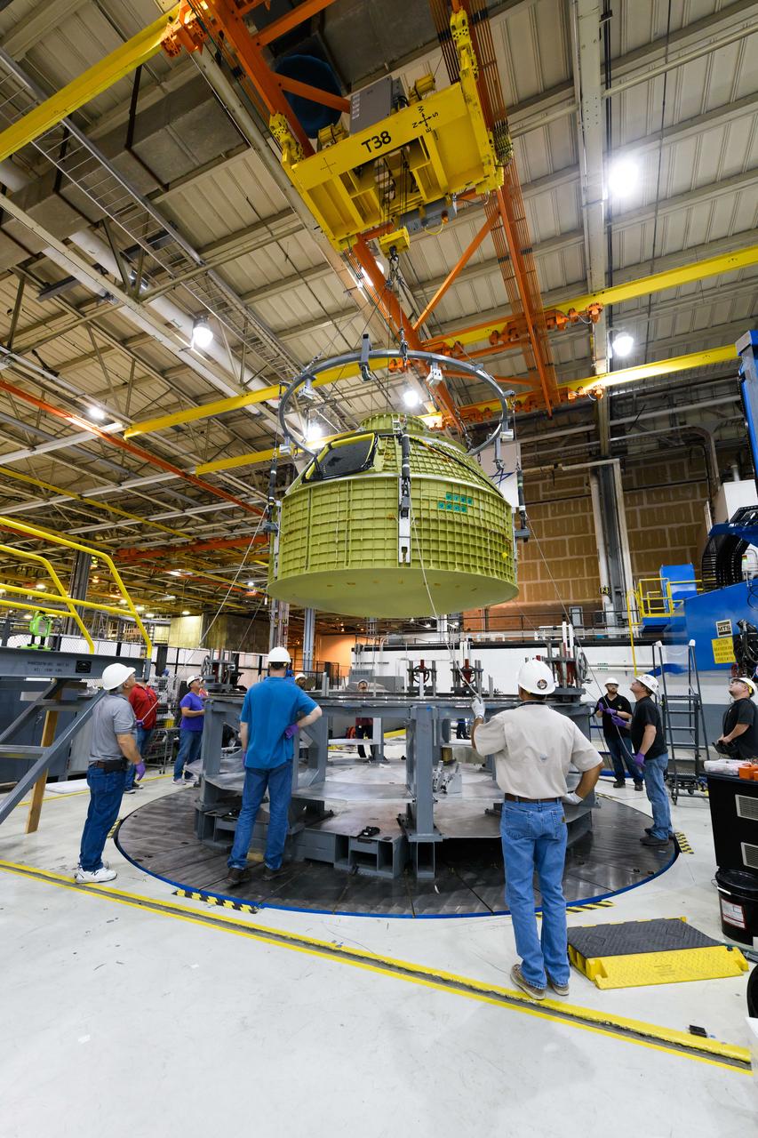 Lockheed Martin technicians at NASA's Michoud Assembly Facility in New Orleans, Louisiana, complete the final weld on the pressure vessel of the Orion crew module for Artemis II on July 24, 2018, the first flight of Orion with astronauts which will carry them farther into the solar system than ever before.