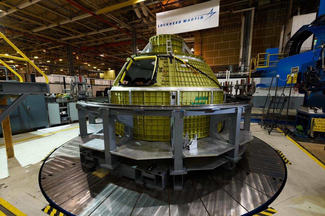 Lockheed Martin technicians at NASA's Michoud Assembly Facility in New Orleans, Louisiana, complete the final weld on the pressure vessel of the Orion crew module for Artemis II on July 24, 2018, the first flight of Orion with astronauts which will carry them farther into the solar system than ever before.