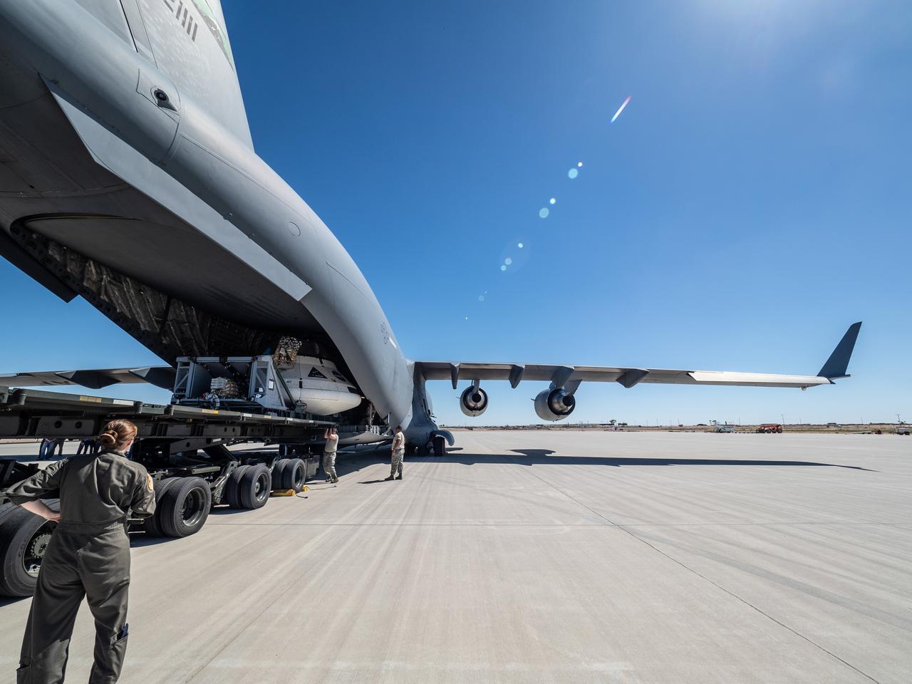 The Orion team prepares the parachute test vehicle for the final drop test which will qualify Orion's parachutes for human flight on Sept. 10, 2018...On September 12, 2018 an Orion test capsule will be dropped from a C-17 aircraft at an altitude of more than six miles to verify the spacecraft’s complex system of 11 parachutes, cannon-like mortars, and pyrotechnic devices work in sequence to slow the capsule’s descent for a safe landing on Earth.