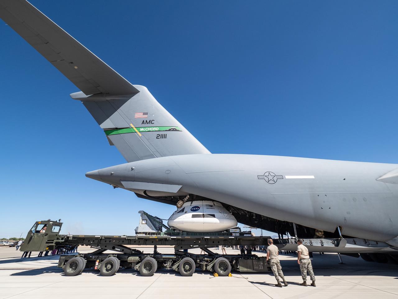 The Orion team prepares the parachute test vehicle for the final drop test which will qualify Orion's parachutes for human flight on Sept. 10, 2018...On September 12, 2018 an Orion test capsule will be dropped from a C-17 aircraft at an altitude of more than six miles to verify the spacecraft’s complex system of 11 parachutes, cannon-like mortars, and pyrotechnic devices work in sequence to slow the capsule’s descent for a safe landing on Earth.