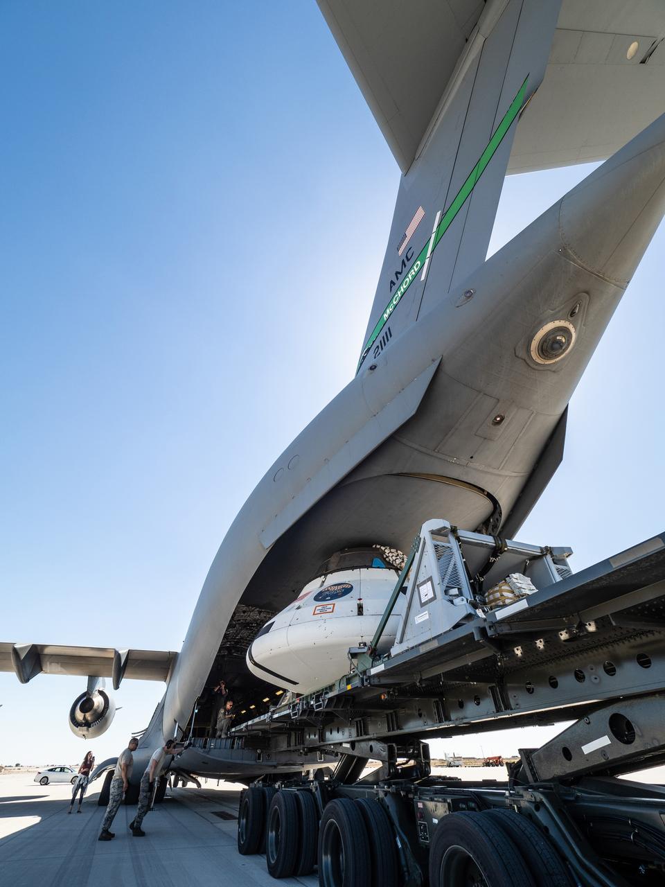 The Orion team prepares the parachute test vehicle for the final drop test which will qualify Orion's parachutes for human flight on Sept. 10, 2018...On September 12, 2018 an Orion test capsule will be dropped from a C-17 aircraft at an altitude of more than six miles to verify the spacecraft’s complex system of 11 parachutes, cannon-like mortars, and pyrotechnic devices work in sequence to slow the capsule’s descent for a safe landing on Earth.