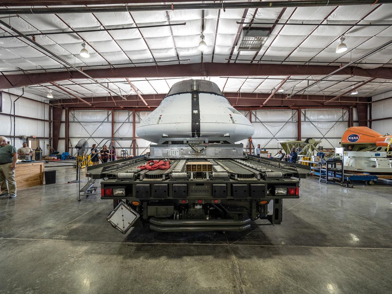 The Orion team prepares the parachute test vehicle for the final drop test which will qualify Orion's parachutes for human flight on Sept. 10, 2018...On September 12, 2018 an Orion test capsule will be dropped from a C-17 aircraft at an altitude of more than six miles to verify the spacecraft’s complex system of 11 parachutes, cannon-like mortars, and pyrotechnic devices work in sequence to slow the capsule’s descent for a safe landing on Earth.