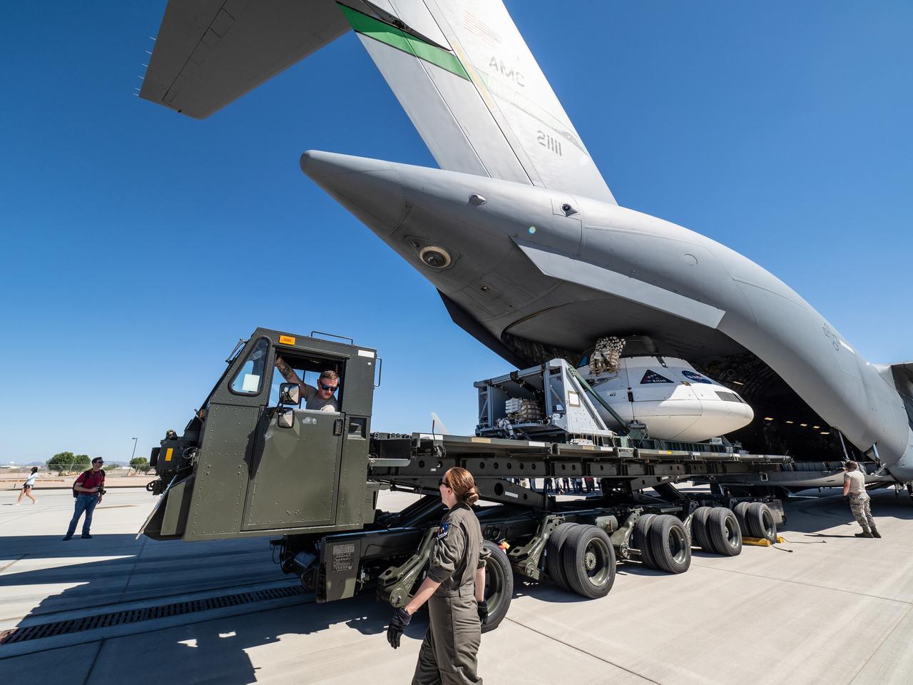 The Orion team prepares the parachute test vehicle for the final drop test which will qualify Orion's parachutes for human flight on Sept. 10, 2018...On September 12, 2018 an Orion test capsule will be dropped from a C-17 aircraft at an altitude of more than six miles to verify the spacecraft’s complex system of 11 parachutes, cannon-like mortars, and pyrotechnic devices work in sequence to slow the capsule’s descent for a safe landing on Earth.