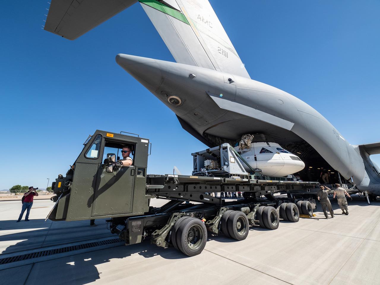 The Orion team prepares the parachute test vehicle for the final drop test which will qualify Orion's parachutes for human flight on Sept. 10, 2018...On September 12, 2018 an Orion test capsule will be dropped from a C-17 aircraft at an altitude of more than six miles to verify the spacecraft’s complex system of 11 parachutes, cannon-like mortars, and pyrotechnic devices work in sequence to slow the capsule’s descent for a safe landing on Earth.